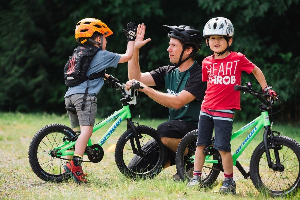 Kids on green lightweight 16 inch bikes high five 